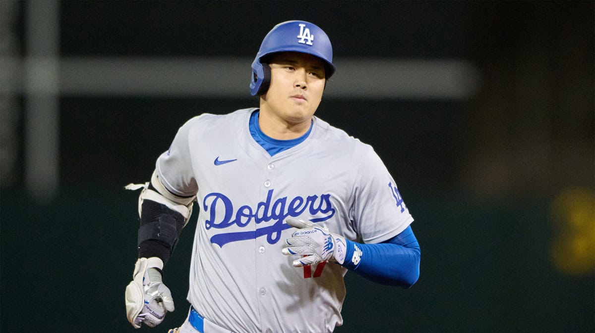 Los Angeles Dodgers designated hitter Shohei Ohtani (17) runs the bases after hitting a three run home run against the Oakland Athletics during the ninth inning at Oakland-Alameda County Coliseum.