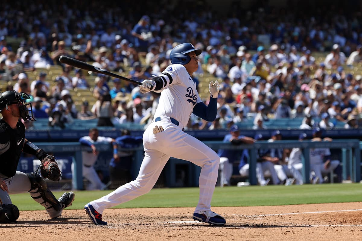 Los Angeles Dodgers designated hitter Shohei Ohtani (17) hits a triple during the sixth inning against the Pittsburgh Pirates at Dodger Stadium.