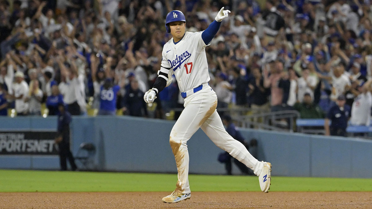 Aug 23, 2024; Los Angeles, California, USA; Los Angeles Dodgers designated hitter Shohei Ohtani (17) rounds the bases on a walk-off grand slam home run for his 40th of the season in the ninth inning against the Tampa Bay Rays at Dodger Stadium.