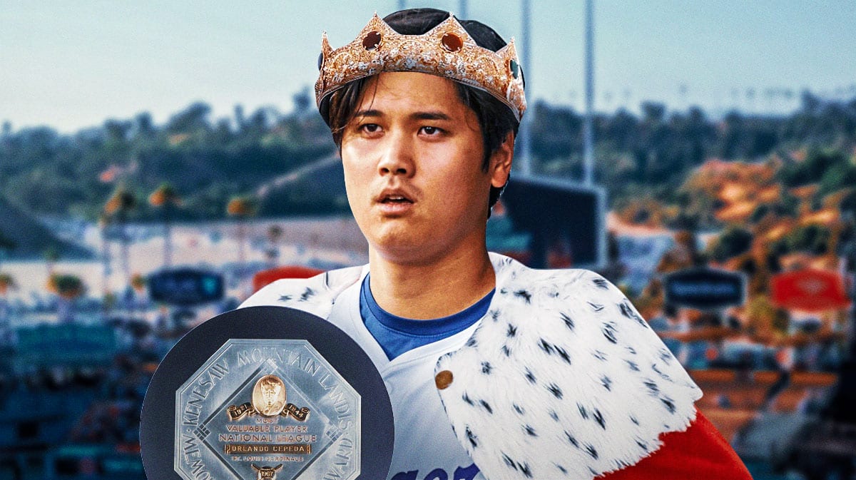 Dodgers DH Shohei Ohtani with crown and cape with the MLB MVP award in front of him