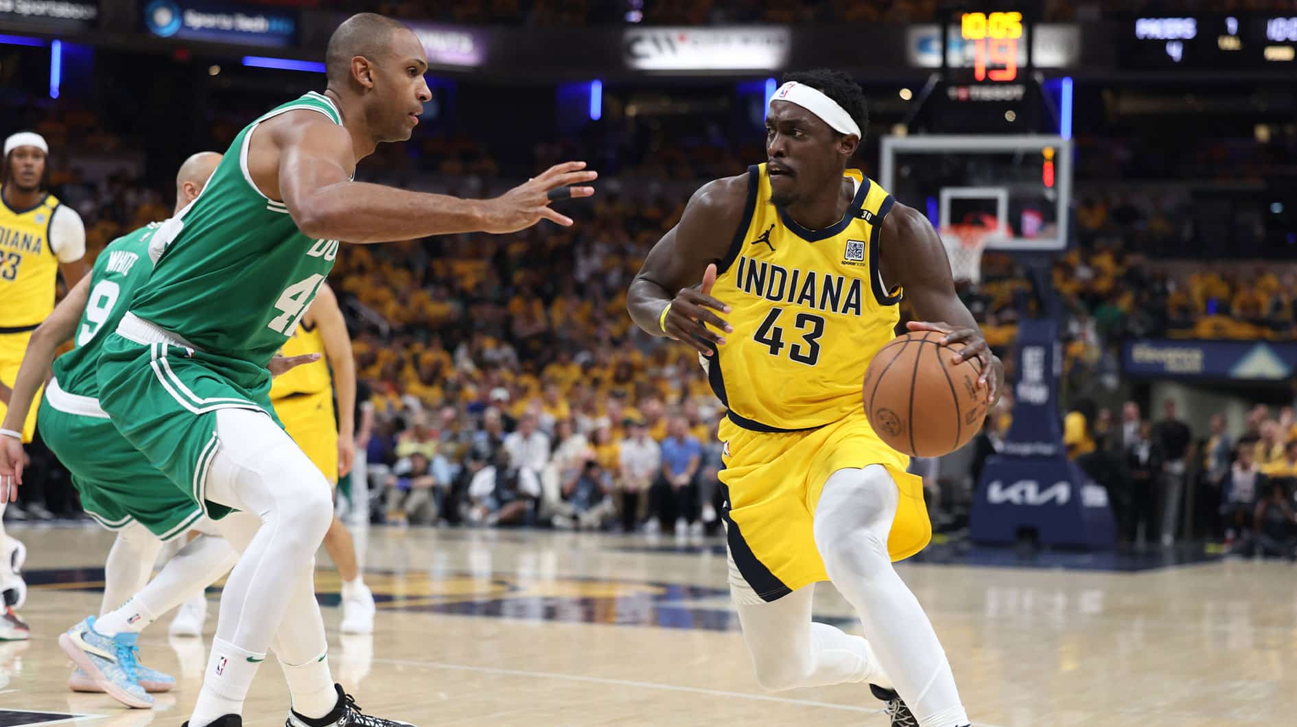 Indiana Pacers forward Pascal Siakam (43) controls the ball against Boston Celtics center Al Horford (42) during the first quarter of game three of the eastern conference finals in the 2024 NBA playoffs at Gainbridge Fieldhouse. 