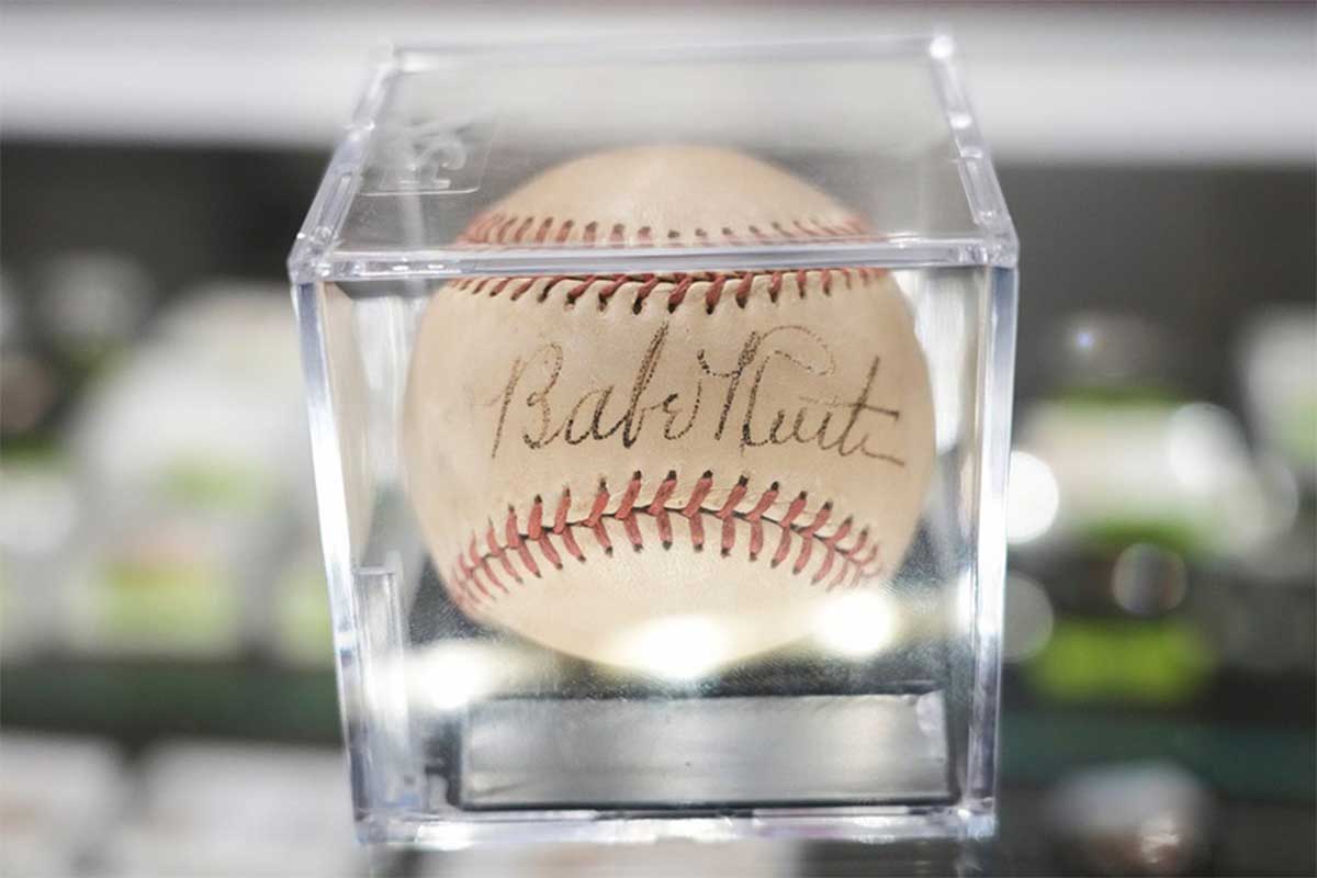 A baseball signed by Babe Ruth sits on display at Austin Auction Gallery Friday, Jan. 20, 2023. The signed and graded baseball will soon be on display at Collectors Crossroads, a store specializing in collections and memorabilia, in Cedar Park.