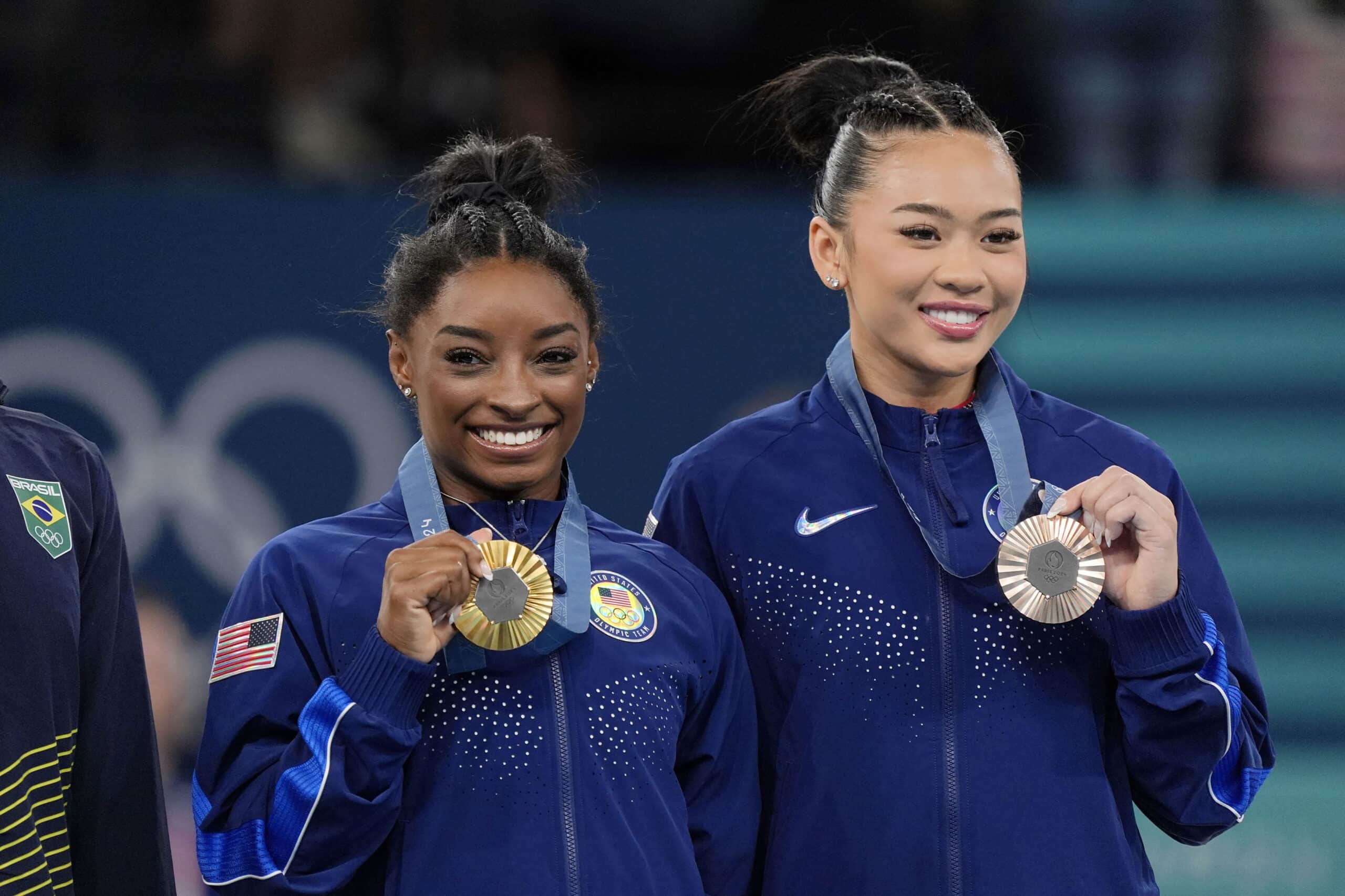 Simone Biles and Sunisa Lee of the United States pose for a photo with their medals in the womenís gymnastics all-around during the Paris 2024 Olympic Summer Games at Bercy Arena. 