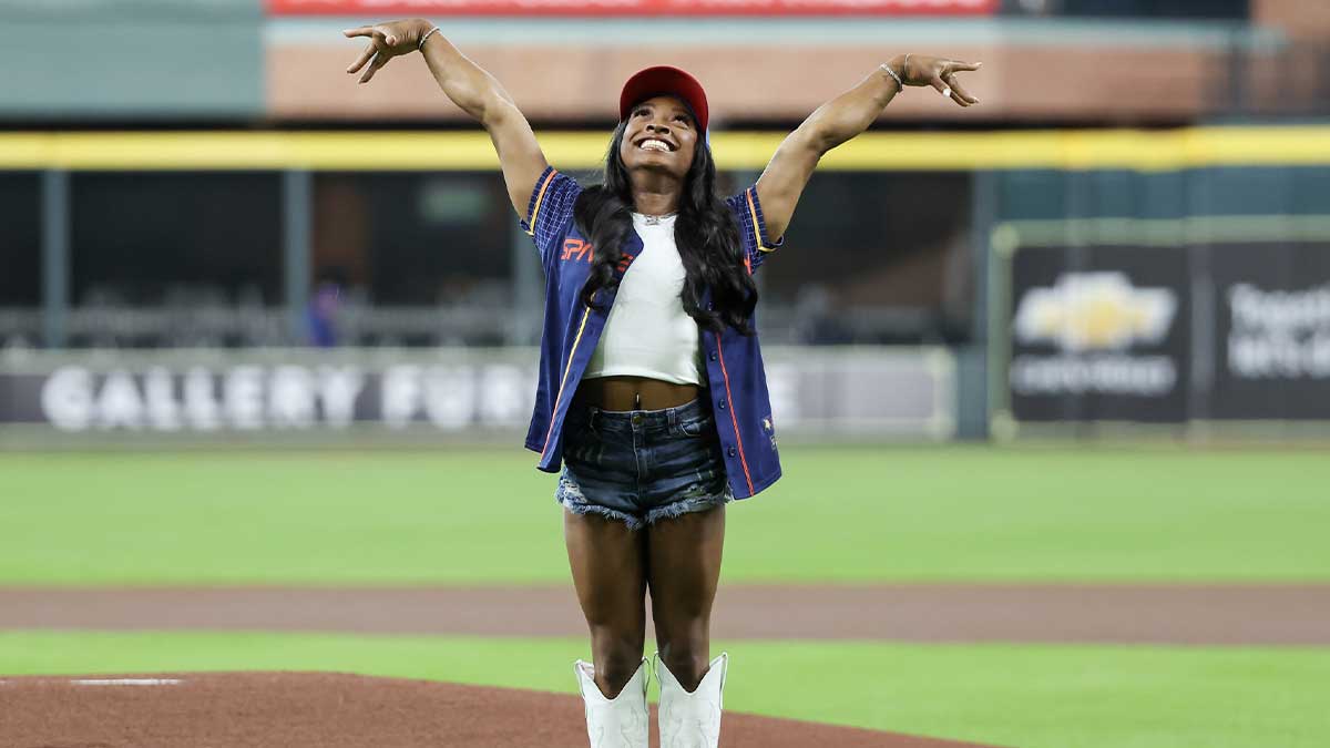 Simone Biles, Paris Summer Olympics 2024 gymnast gold medal winner, reacts after throwing out the ceremonial first pitch. Olympian teammate and gold medalist , Jordan Chiles, and the Houston area Olympians were also in attendance before the Kansas City Royals played against the Houston Astros at Minute Maid Park.