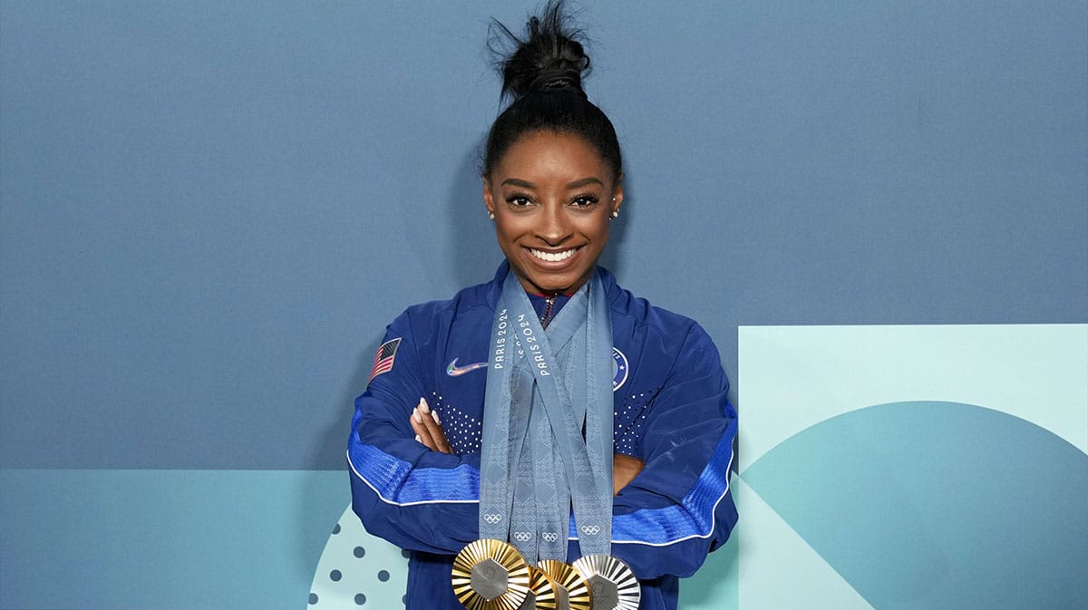 Aug 5, 2024; Paris, France; Simone Biles of the United States poses for a photo with her three gold and one silver medal after day three of the gymnastics event finals during the Paris 2024 Olympic Summer Games. 