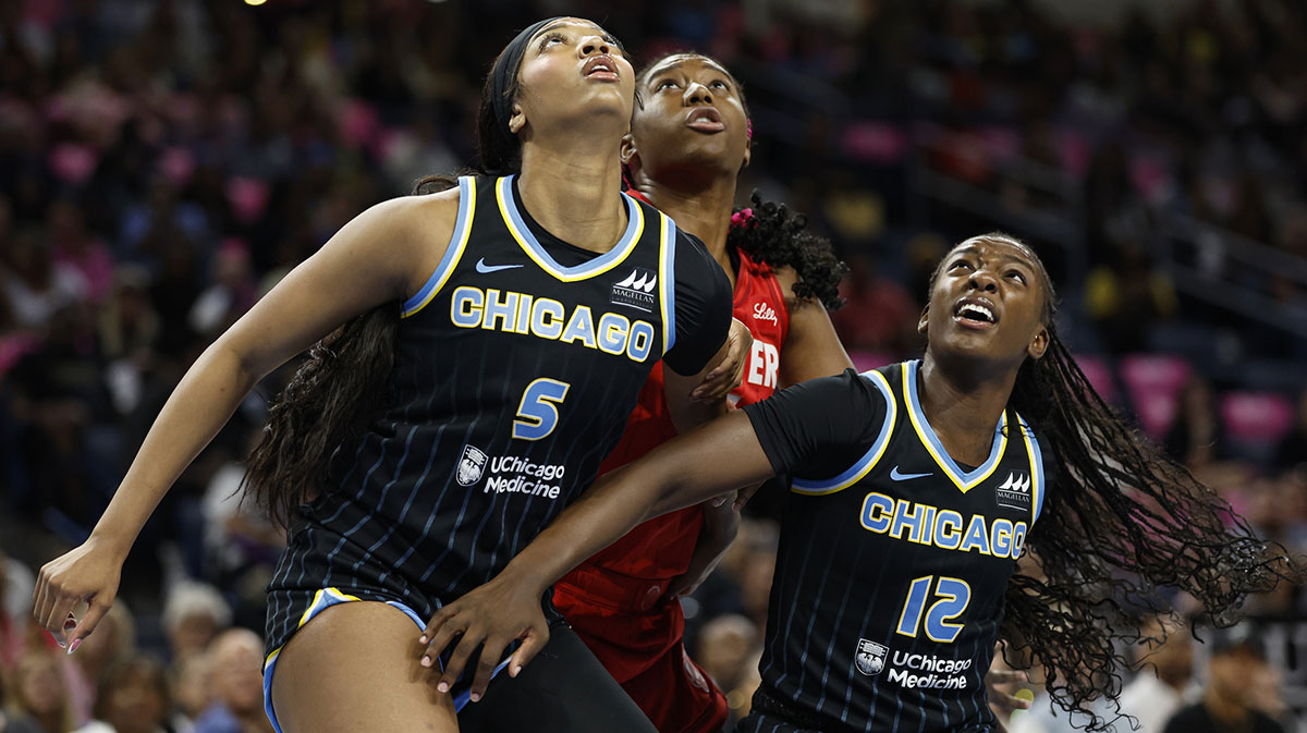 Aug 30, 2024; Chicago, Illinois, USA; Chicago Sky forward Angel Reese (5) and forward Michaela Onyenwere (12) defend against Indiana Fever forward Aliyah Boston (7)