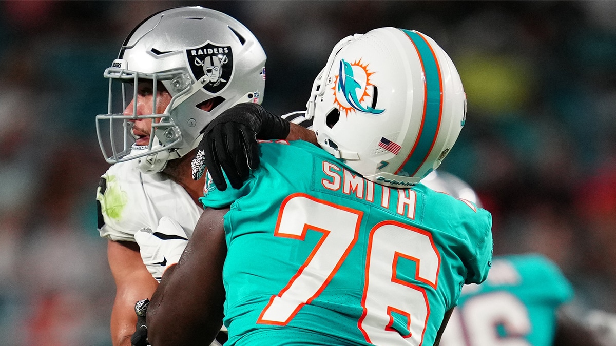 Miami Dolphins offensive tackle Kion Smith (76) blocks Las Vegas Raiders defensive end Tashawn Bower (96) in the second quarter at Hard Rock Stadium.