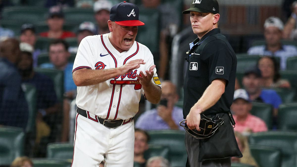 ; Atlanta Braves manager Brian Snitker (43) reacts to umpire Brian Walsh (120) after being ejected from a game against the Milwaukee Brewers in the fifth inning at Truist Park