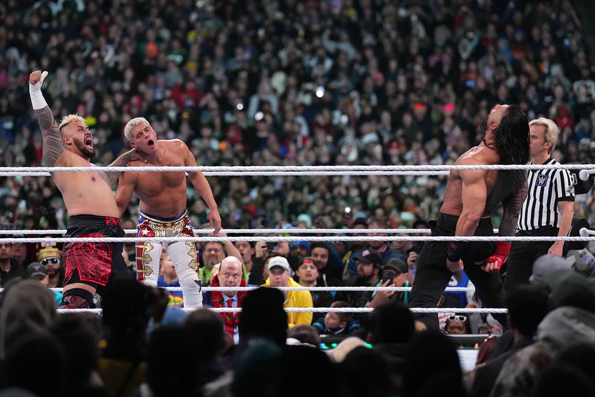 Solo Sikoa and Roman Reigns attacking Cody Rhodes at WrestleMania XL.