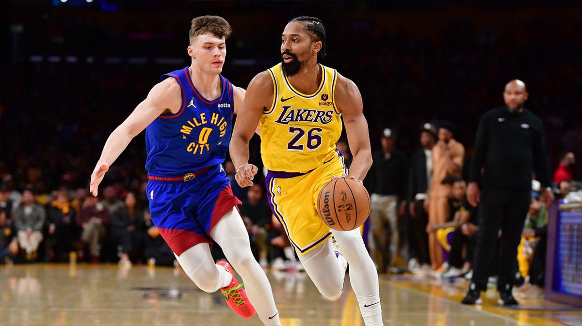 Los Angeles Lakers guard Spencer Dinwiddie (26) moves the ball ahead of Denver Nuggets guard Christian Braun (0) during the second half in game three of the first round for the 2024 NBA playoffs at Crypto.com Arena. 