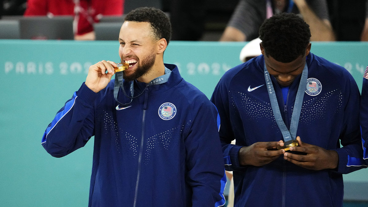 Team USA shooting guard Stephen Curry (4) celebrates with the gold medal after saying "Night Night" to France in the men's basketball gold medal game during the Paris 2024 Olympic Summer Games at Accor Arena