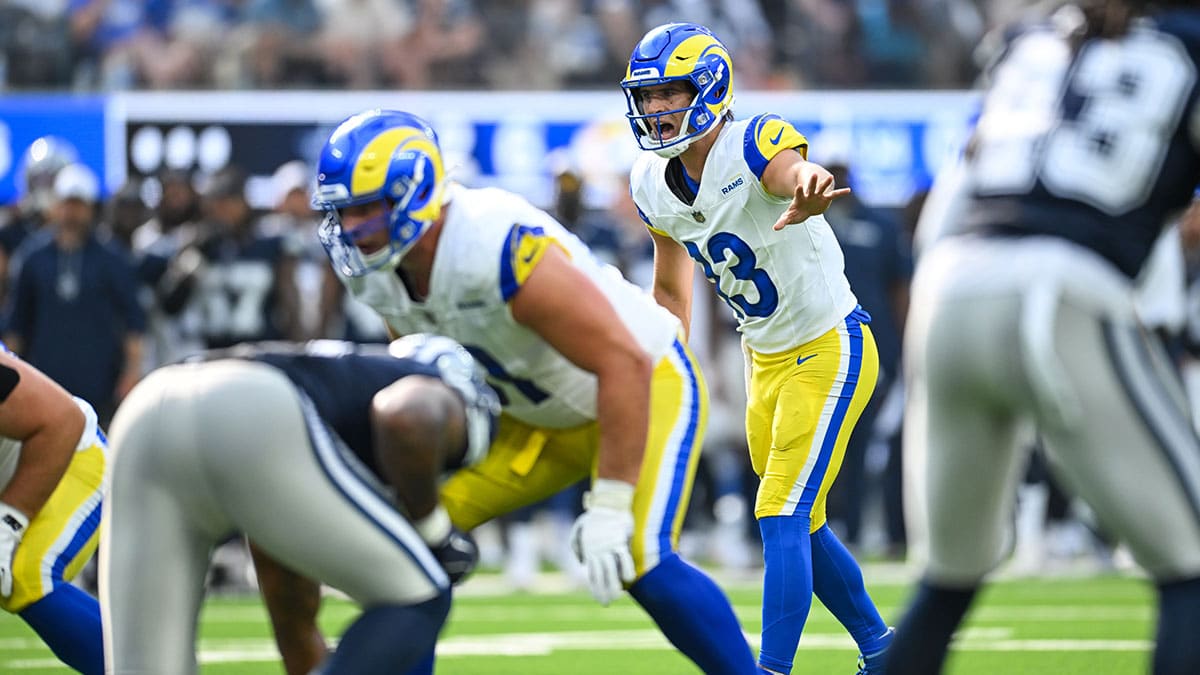 Los Angeles Rams quarterback Stetson Bennett (13) calls the play against the Dallas Cowboys during the fourth quarter at SoFi Stadium.