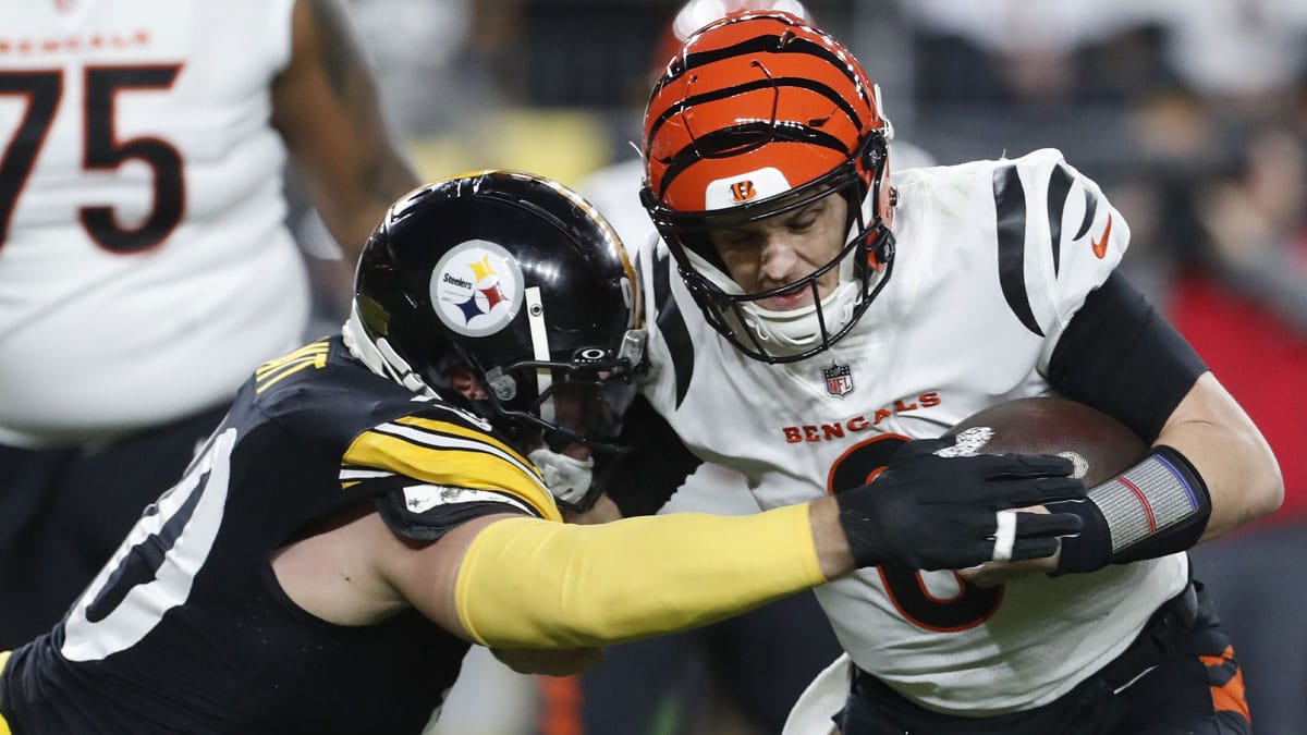 Pittsburgh Steelers linebacker T.J. Watt (90) sacks Cincinnati Bengals quarterback Jake Browning (6) during the second quarter at Acrisure Stadium.