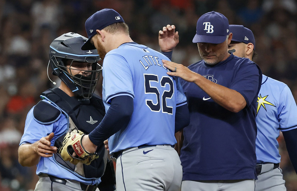 Tampa Bay Rays manager Kevin Cash (16) pats starting pitcher Zack Littell (52) on the back after he was taken out of the game against the Houston Astros in the sixth inning at Minute Maid Park.