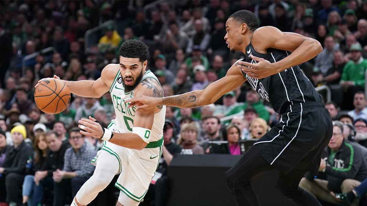 Boston Celtics forward Jayson Tatum (0) drives the ball against Brooklyn Nets center Nic Claxton (33) in the first quarter at TD Garden.