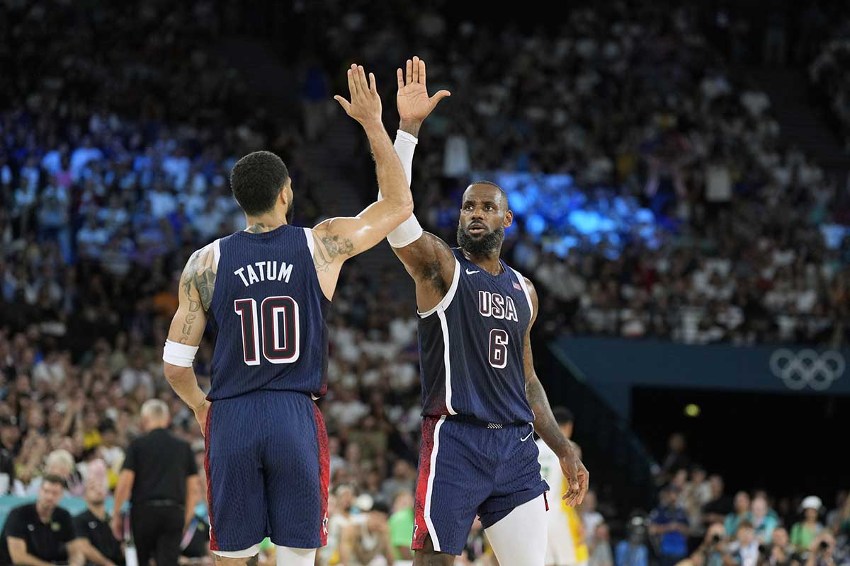  United States guard LeBron James (6) and small forward Jayson Tatum (10) react in the first half against Brazil in a men’s basketball quarterfinal game during the Paris 2024 Olympic Summer Games at Accor Arena.