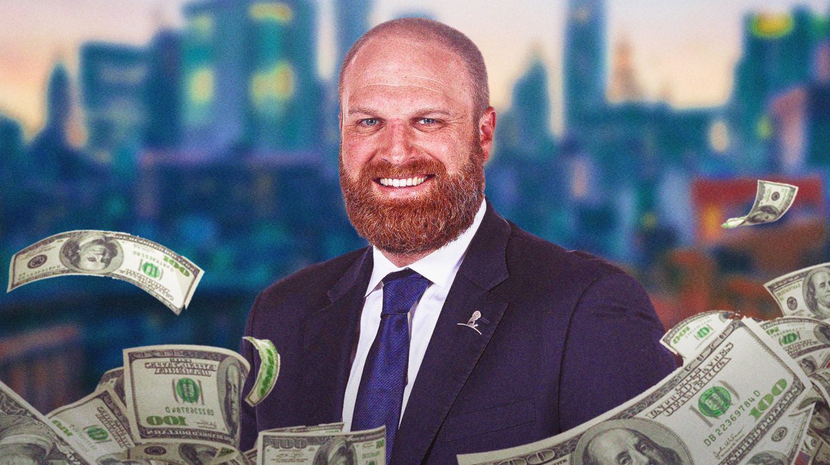 Memphis Grizzlies coach surrounded by piles of cash.