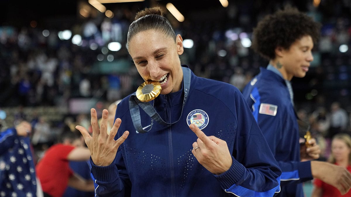 United States shooting guard Diana Taurasi (12) celebrates after the receiving the gold medal in women’s basketball during the Paris 2024 Olympic Summer Games at Accor Arena.