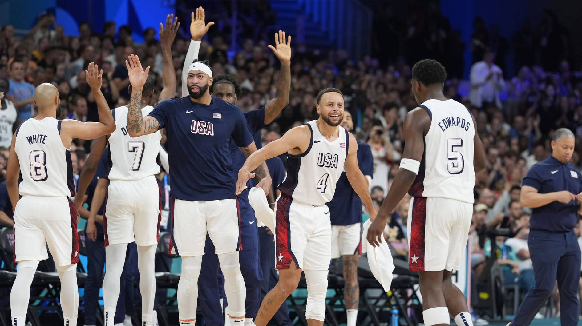 United States shooting guard Stephen Curry (4) celebrates with guard Anthony Edwards (5) after a time out in the first quarter against South Sudan during the Paris 2024 Olympic Summer Games at Stade Pierre-Mauroy