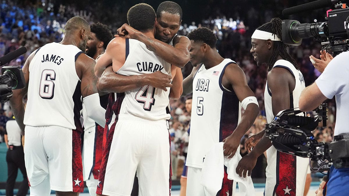 United States shooting guard Stephen Curry (4) and guard Kevin Durant (7) embrace after the game against Serbia in a men's basketball semifinal game during the Paris 2024 Olympic Summer Games at Accor Arena.