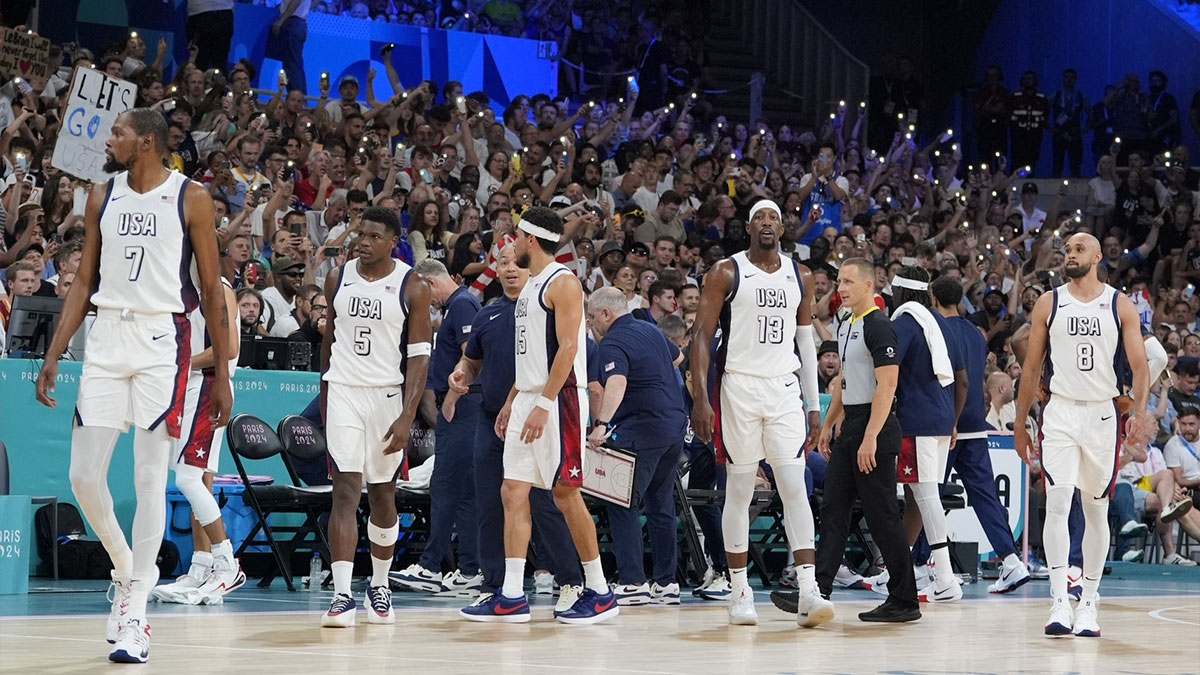 The United States team returns to the floor after a timeout in the second quarter against South Sudan during the Paris 2024 Olympic Summer Games at Stade Pierre-Mauroy