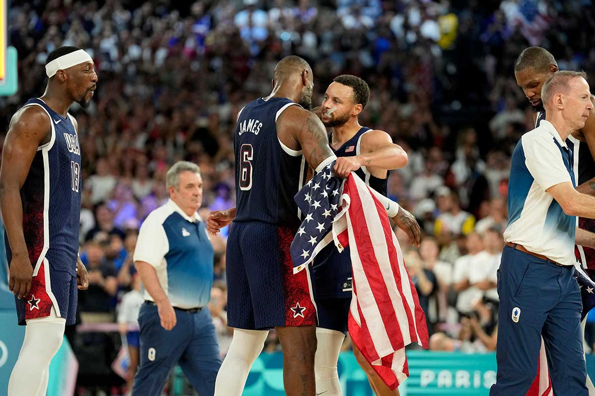 United States shooting guard Stephen Curry (4) and guard LeBron James (6) celebrate after defeating France in the men's basketball gold medal game during the Paris 2024 Olympic Summer Games at Accor Arena.