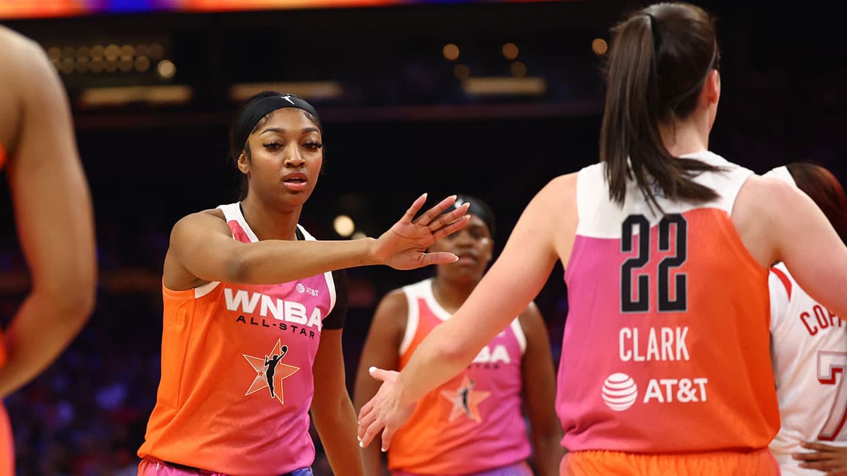 Jul 20, 2024; Phoenix, AZ, USA; Team WNBA guard Caitlin Clark (22) and Angel Reese against the USA Women's National Team during the 2024 WNBA All Star Game at Footprint Center. Mandatory Credit: Mark J. Rebilas-USA TODAY Sports