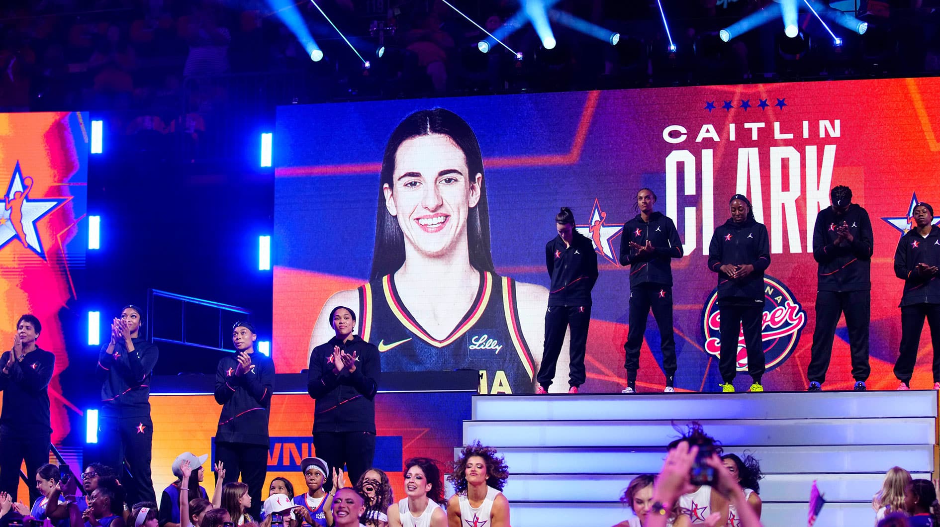 Team WNBA guard Caitlin Clark waves to fans after being announced in introductions during the WNBA All-Star Game at Footprint Center in Phoenix on July 20, 2024.