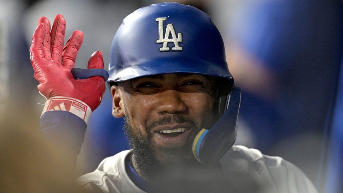 Los Angeles Dodgers left fielder Teoscar Hernandez (37) celebrates in the dugout after hitting a two-run home run in the third inning against the Philadelphia Phillies at Dodger Stadium.