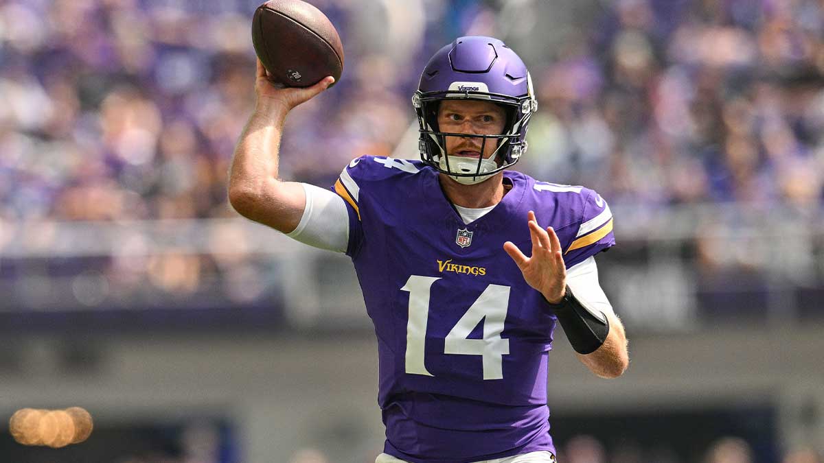 Minnesota Vikings quarterback Sam Darnold (14) throws a pass against the Las Vegas Raiders during the first quarter at U.S. Bank Stadium.