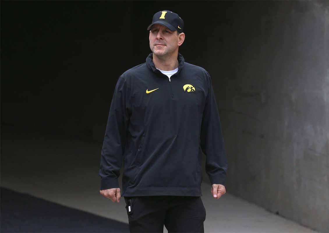 Iowa Hawkeyes offensive coordinator Tim Lester walks out of the tunnel ahead of an open spring practice