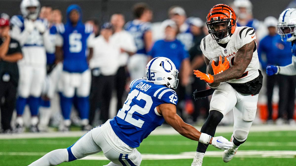 Cincinnati Bengals halfback Trayveon Williams (32) breaks through the defense of Indianapolis Colts safety Marcel Dabo (42) in the third quarter of the NFL preseason at Paycor Stadium in Cincinnati on Thursday, Aug. 22, 2024.