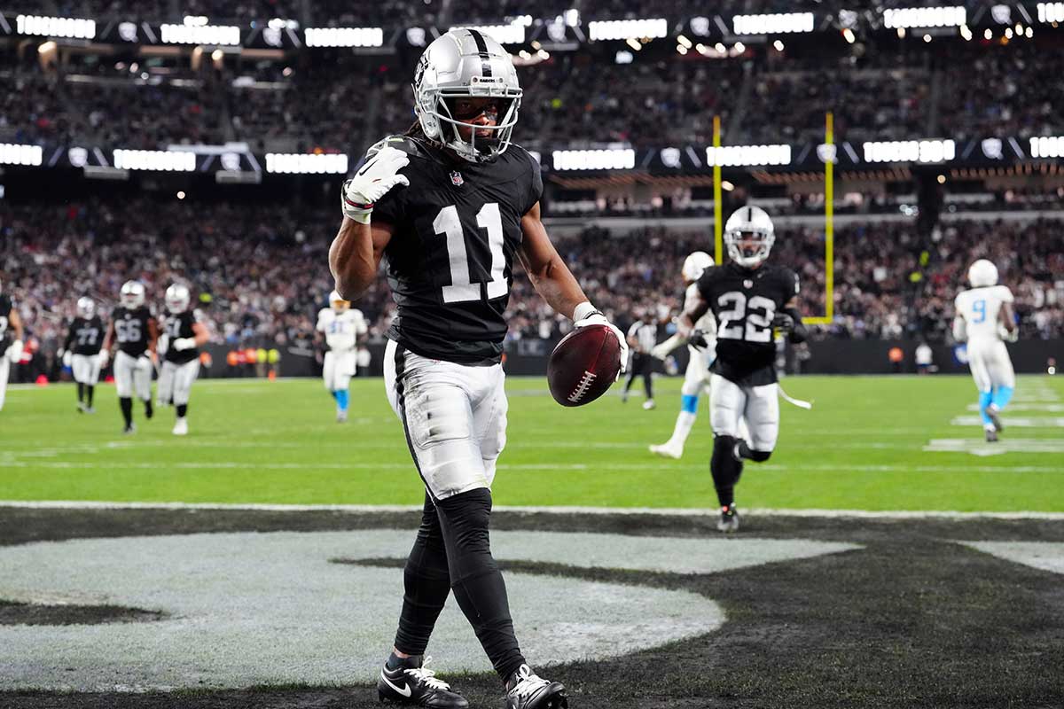 Dec 14, 2023; Paradise, Nevada, USA; Las Vegas Raiders wide receiver Tre Tucker (11) celebrates after a turnover against the Los Angeles Chargers in the second quarter at Allegiant Stadium. Mandatory Credit: Stephen R. Sylvanie-USA TODAY Sports