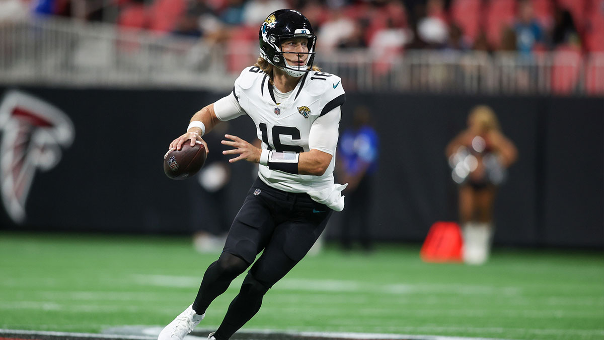 Trevor Lawrence throwing the football on the Jaguars