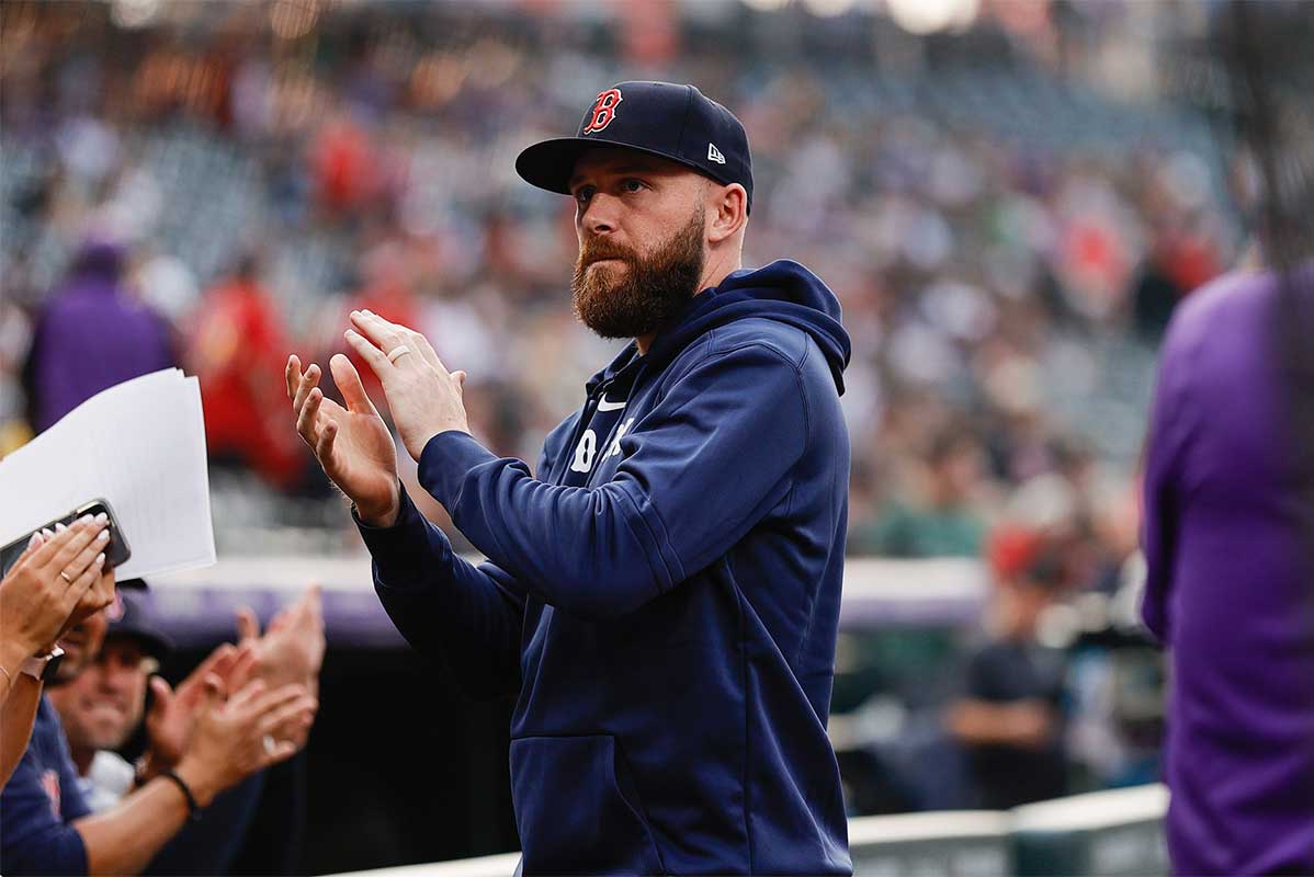 Boston Red Sox short stop Trevor Story (10) gestures to Colorado Rockies fans before the game at Coors Field.