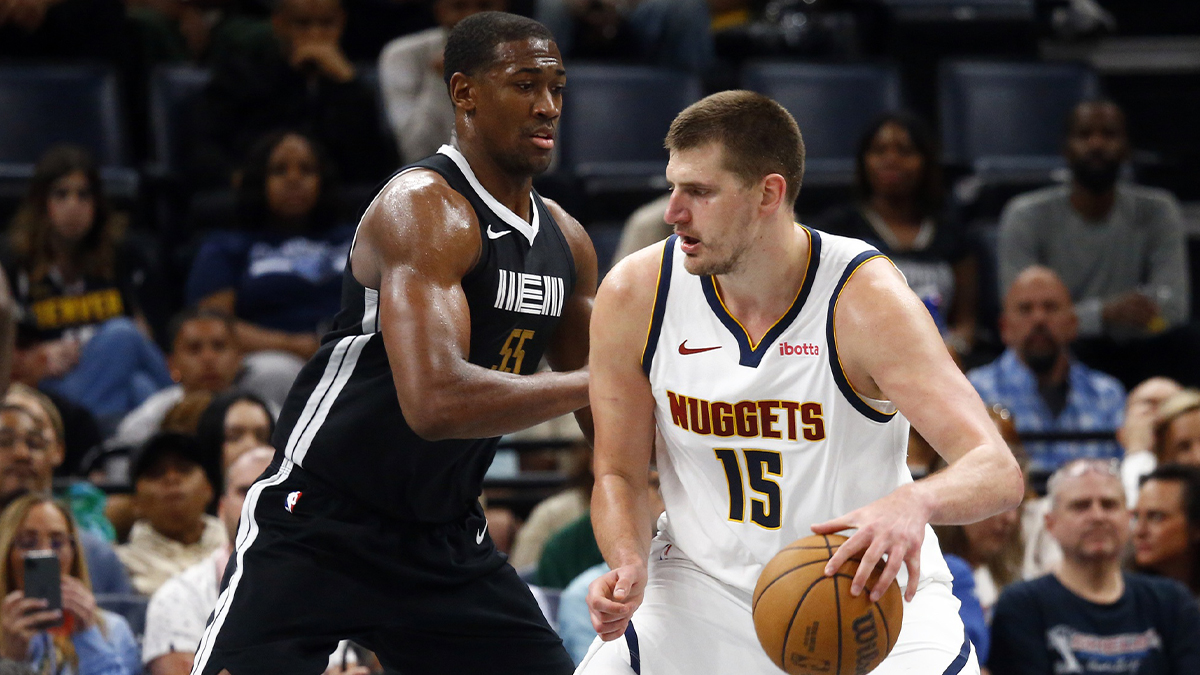 Denver Nuggets center Nikola Jokic (15) dribbles as Memphis Grizzlies center Trey Jemison (55) defends during the second half at FedExForum.