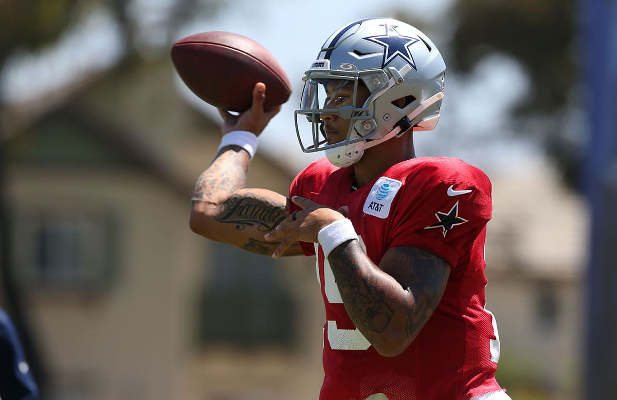 Dallas Cowboys quarterback Trey Lance (19) throws during training camp at the River Ridge Playing Fields in Oxnard, California.