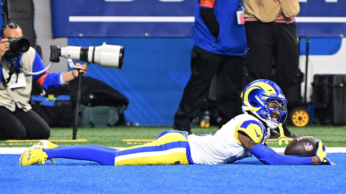 Jan 14, 2024; Detroit, Michigan, USA; Los Angeles Rams wide receiver Tutu Atwell (5) celebrates after a touchdown during the first half of a 2024 NFC wild card game against the Detroit Lions at Ford Field.