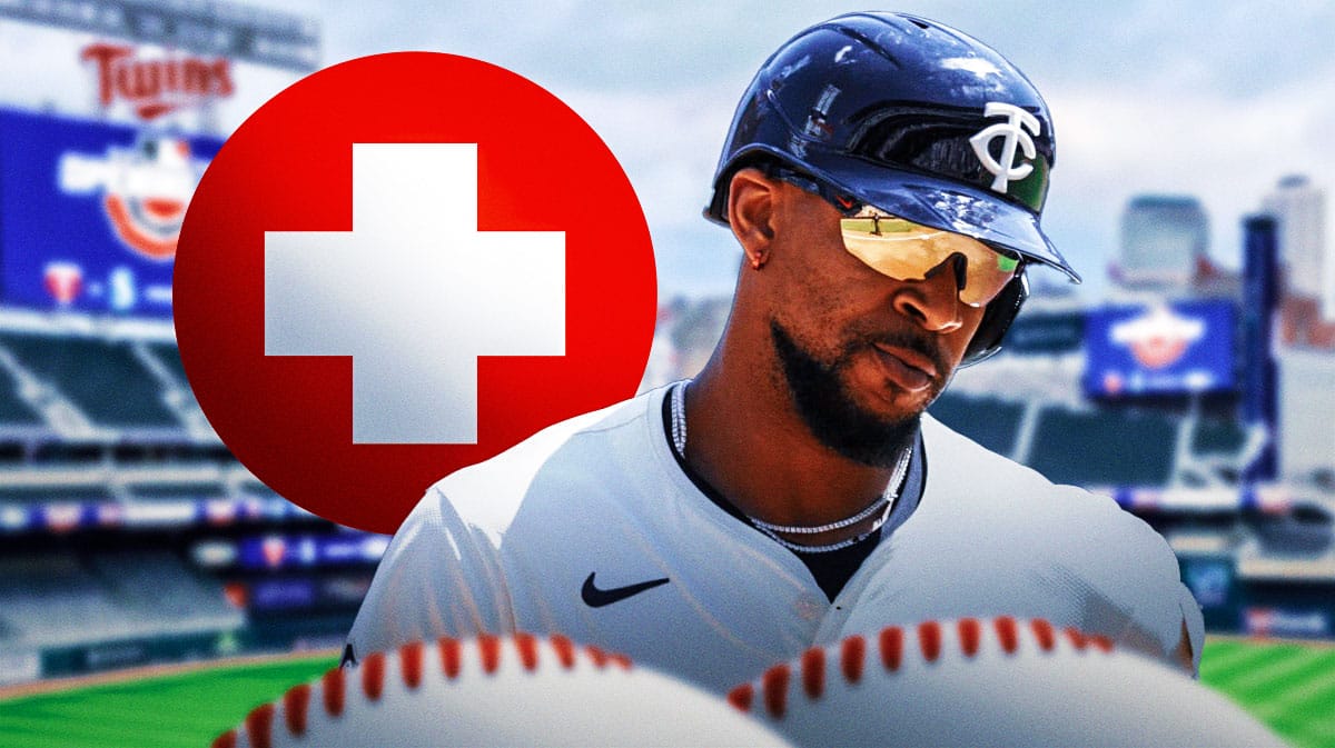 Photo: Byron Buxton in action in Twins jersey, medical kit beside him