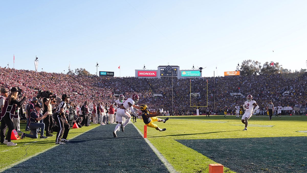 Michigan Wolverines wide receiver Tyler Morris (8) scores a touchdown against Alabama Crimson Tide defensive back Jaylen Key (6) during the first half in the 2024 Rose Bowl college football playoff semifinal game at Rose Bowl.