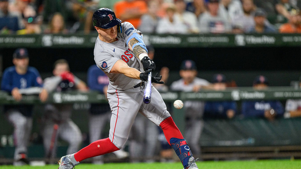 Aug 17, 2024; Baltimore, Maryland, USA; Boston Red Sox outfielder Tyler O'Neill (17) hits a single during the eighth inning against the Baltimore Orioles at Oriole Park at Camden Yards.