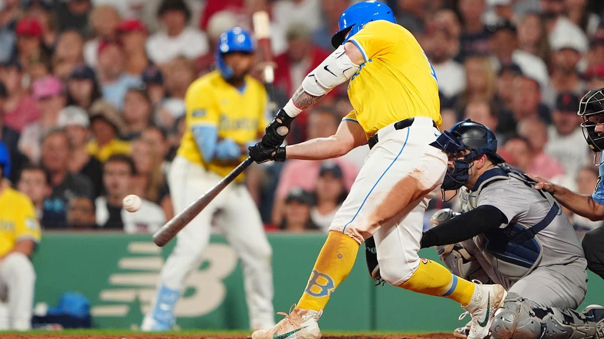 Boston Red Sox left fielder Tyler O'Neill (17) hits a home run against the New York Yankees during the seventh inning at Fenway Park. Mandatory Credit: