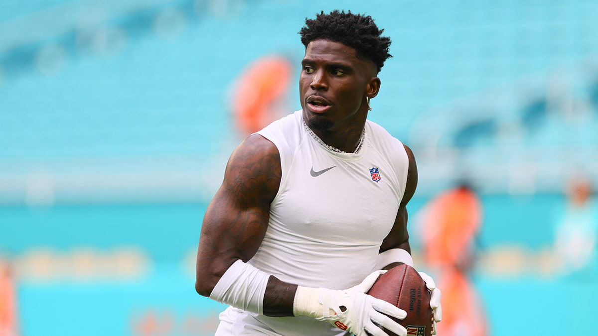 Miami Dolphins wide receiver Tyreek Hill (10) throws the football before preseason game against the Washington Commanders at Hard Rock Stadium.