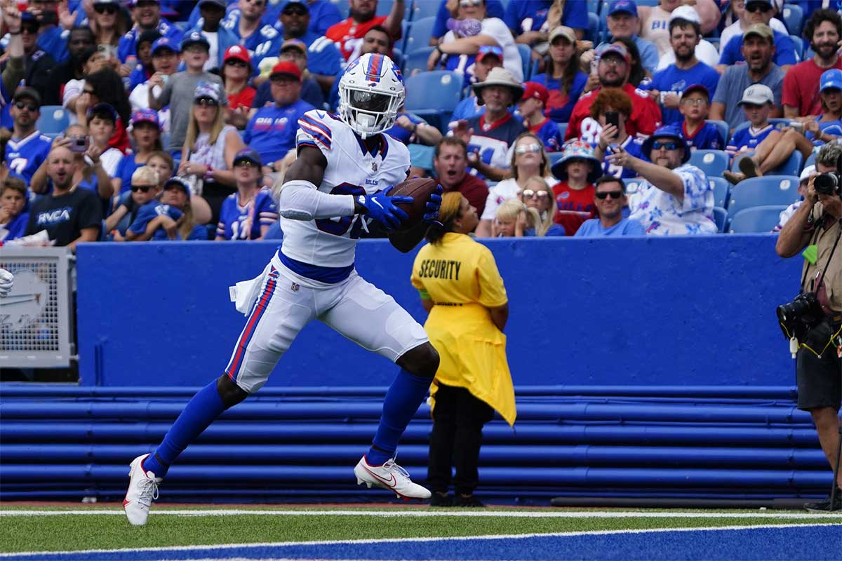 Buffalo Bills wide receiver Tyrell Shavers (80) runs the ball in for a touchdown after making a catch against the Indianapolis Colts during the second half at Highmark Stadium. 