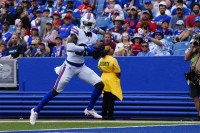 Buffalo Bills wide receiver Tyrell Shavers (80) runs the ball in for a touchdown after making a catch against the Indianapolis Colts during the second half at Highmark Stadium.