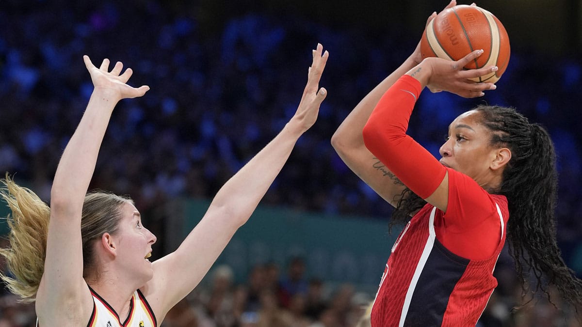 Aug 4, 2024; Villeneuve-d'Ascq, France; United States forward A'Ja Wilson (9) shoots against Germany centre Luisa Geiselsoder (15) in the first half in a women’s group C game during the Paris 2024 Olympic Summer Games at Stade Pierre-Mauroy. Mandatory Credit: John David Mercer-USA TODAY Sports