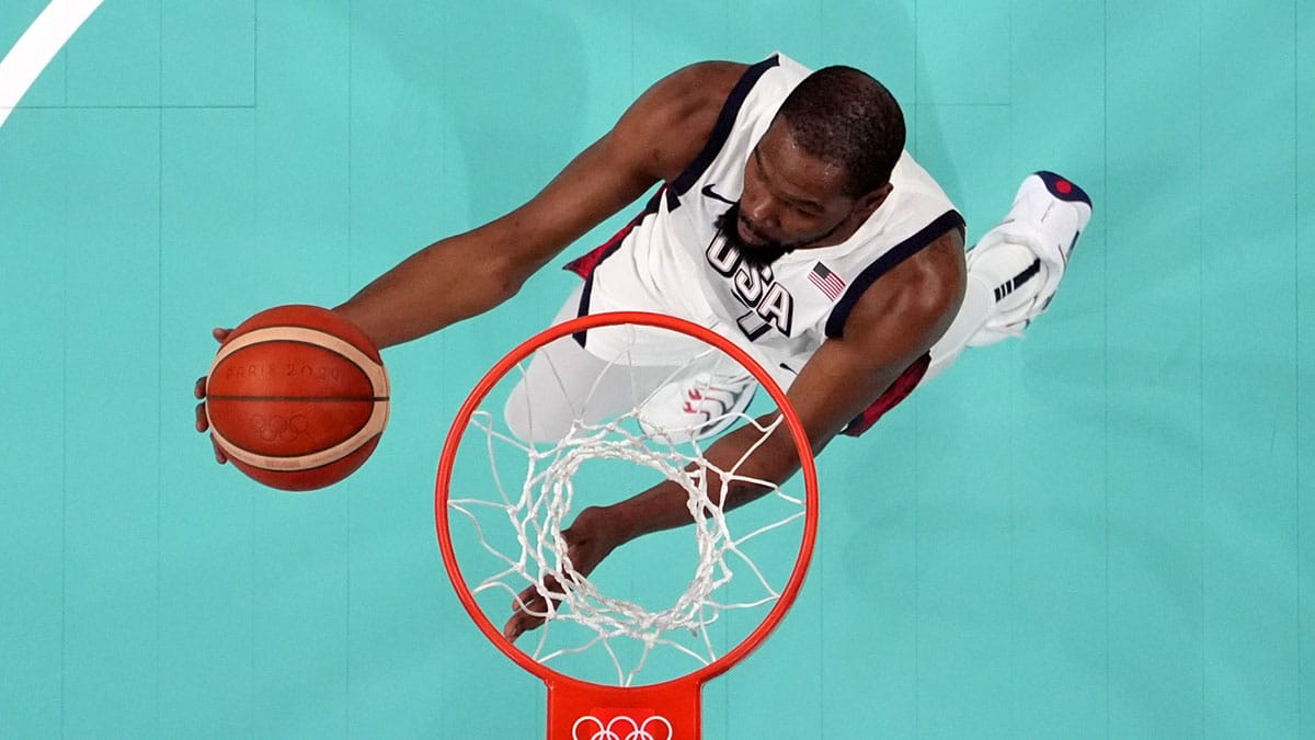 Jul 31, 2024; Villeneuve-d'Ascq, France; United States guard Kevin Durant (7) shoots in the second quarter against South Sudan during the Paris 2024 Olympic Summer Games at Stade Pierre-Mauroy. Mandatory Credit: John David Mercer-USA TODAY Sports