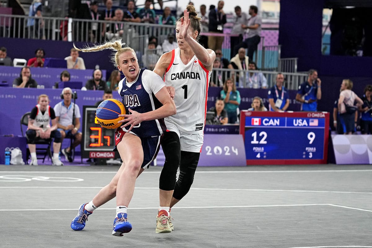 United States player Hailey van Lith (9) drives to the basket against Canada player Michelle Plouffe (1) in the women’s 3x3 basketball bronze medal game during the Paris 2024 Olympic Summer Games.