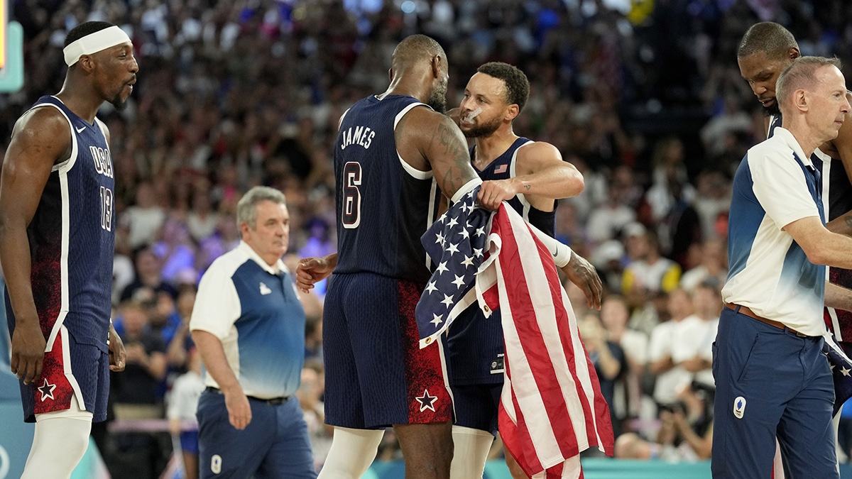 Aug 10, 2024; Paris, France; United States shooting guard Stephen Curry (4) and guard LeBron James (6) celebrate after defeating France in the men's basketball gold medal game during the Paris 2024 Olympic Summer Games at Accor Arena. Mandatory Credit: Kyle Terada-USA TODAY Sports