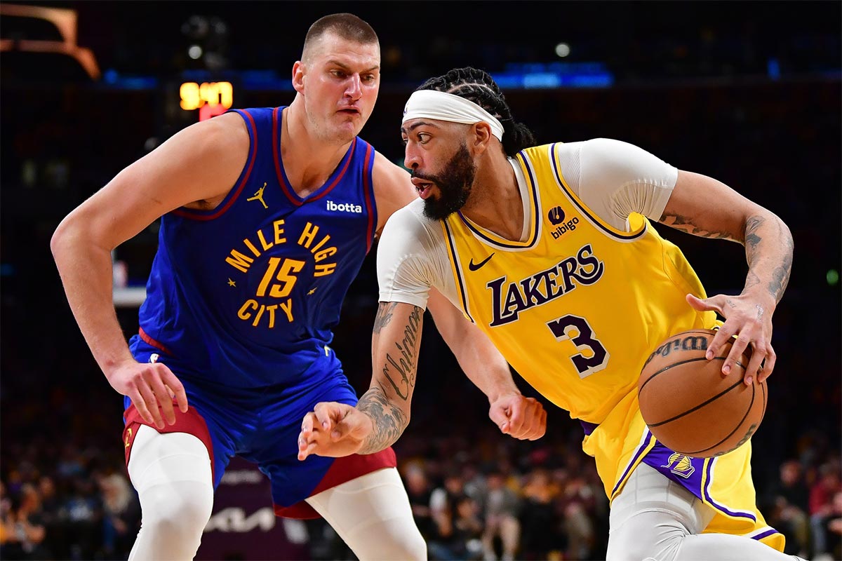 Los Angeles Lakers forward Anthony Davis (3) moves the ball against Denver Nuggets center Nikola Jokic (15) during the second half in game three of the first round for the 2024 NBA playoffs at Crypto.com Arena.